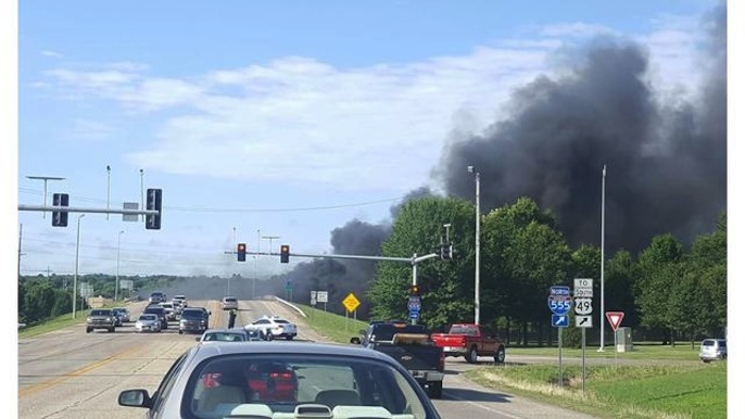 Semi catches fire after crashing into bridge